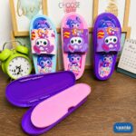 Three colorful Slipper Pencil Boxes in blue, pink, and purple featuring cute bear characters on a wooden desk.