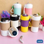 Collection of colorful insulated smart coffee mugs with digital temperature lids and silicone grips.