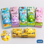Six Pop Squishy Buddy Pencil Boxes in blue, pink, green, and yellow featuring 3D animal characters and sharpeners.