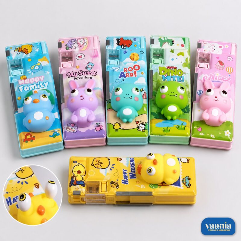 Six Pop Squishy Buddy Pencil Boxes in blue, pink, green, and yellow featuring 3D animal characters and sharpeners.