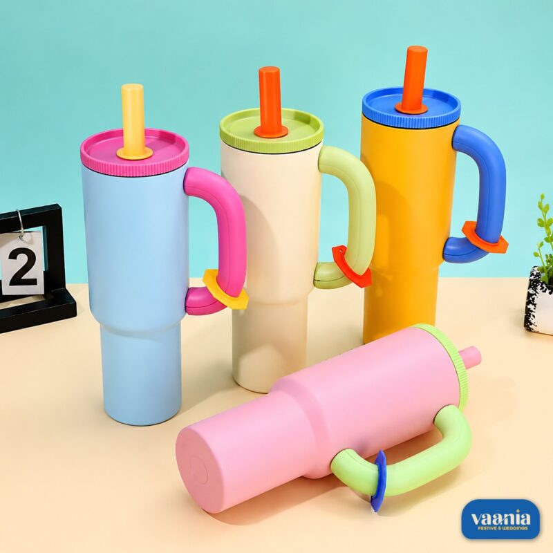 Four colorful Chaco Lab Tumblers in light blue, cream, orange, and pink with contrasting lids and handles.