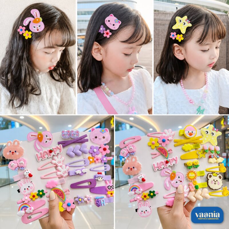 A hand holding three cards of pink Sweet Charm Hair Clips featuring rabbits, rainbows, and flowers. - view 2