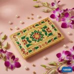 A stack of four golden nested Rectangular Chowkis with floral paintings surrounded by pink orchids and pearls. - view 4