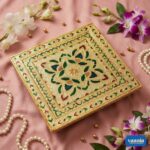 A stack of three Big Square Chowkis with gold finish and floral enamel patterns on a pink background. - view 4