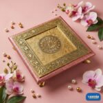 A stack of three tiered Copper Chowkis with ornate golden engravings and pink borders on a pink background. - view 3