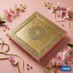 A stack of three tiered Copper Chowkis with ornate golden engravings and pink borders on a pink background. - view 5