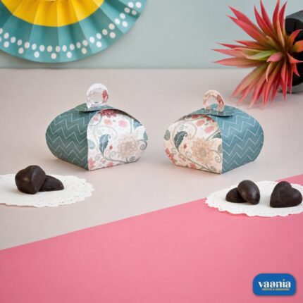 Two Multi Purpose Boxes with floral and chevron patterns featuring heart-shaped chocolates on a pink and beige background.