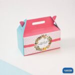 A pink and blue Multi Purpose Box with floral wreath design and Smile of Happiness text.