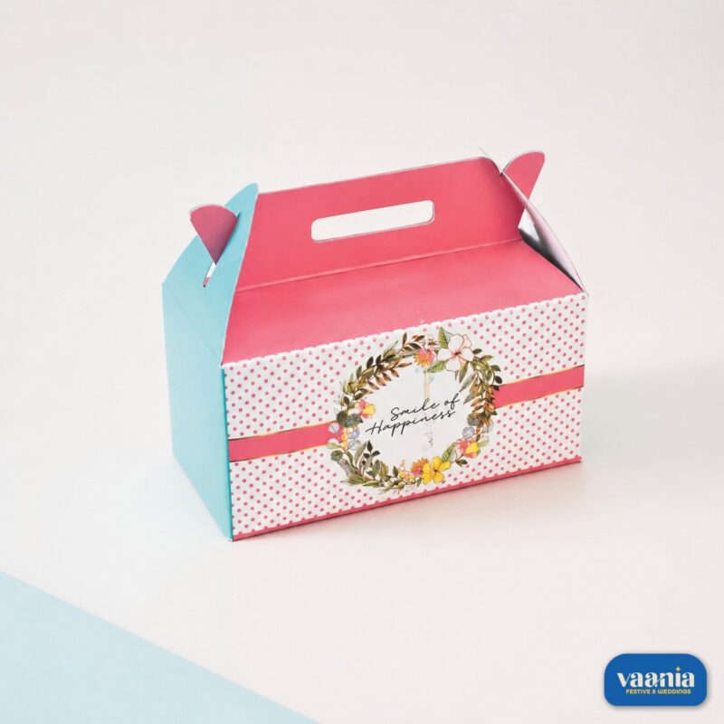 A pink and blue Multi Purpose Box with floral wreath design and Smile of Happiness text.