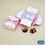 Pink floral Multi Purpose Cavity Box showing open and closed views with chocolates on a neutral background.