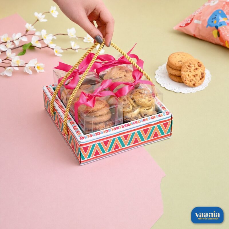 A decorative Hamper Tray with Boxes Compartment filled with cookies, featuring a colorful geometric base and gold handles.