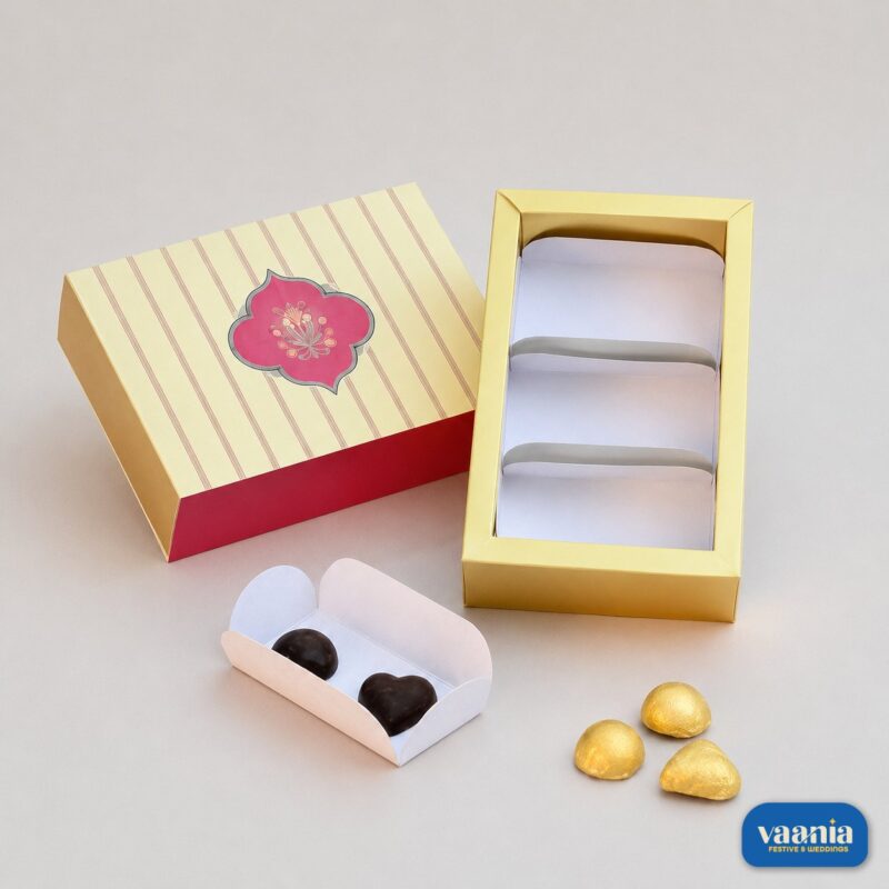 A decorative Sliding Box - Cavity Box (3 Big Cavity) with a striped lid, gold tray, and loose chocolates.