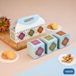 A decorative light blue Hamper Box Set with a handle and three matching square inner boxes displaying floral motifs.