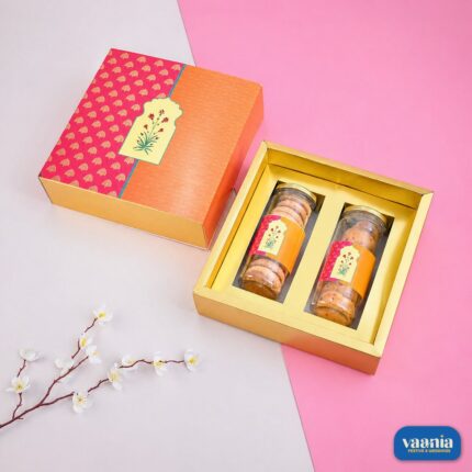 Orange and pink patterned Sliding Box opened to reveal two transparent Pet Jars filled with cookies.