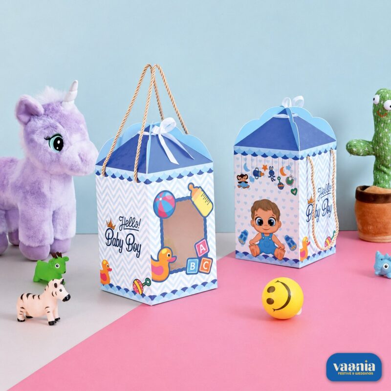 Two blue and white baby boy hamper boxes with rope handles featuring baby illustrations next to a purple stuffed horse.