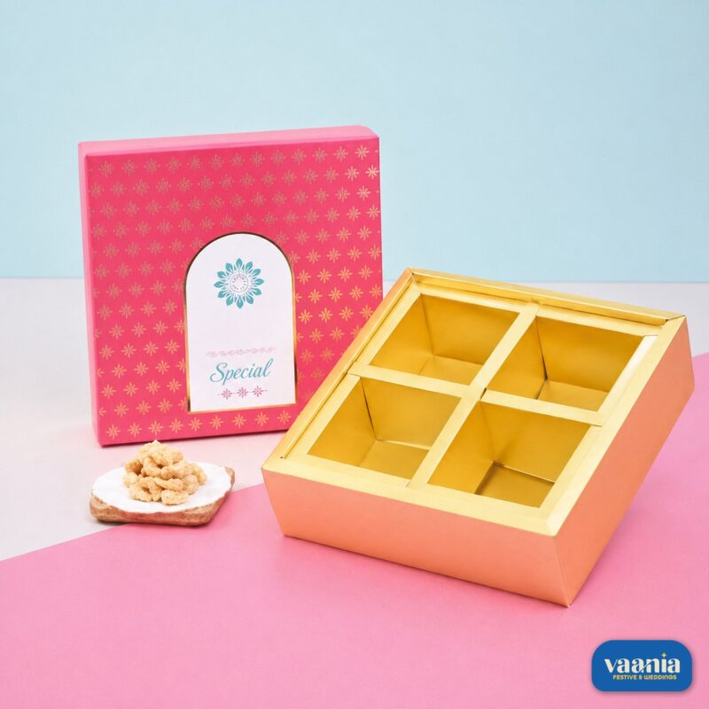 A pink Top-Bottom Hamper with 4 compartments, featuring a gold interior and patterned lid.